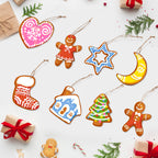 Colorful Christmas-themed cookie cutout ornaments on a white background with gift boxes and candy canes.