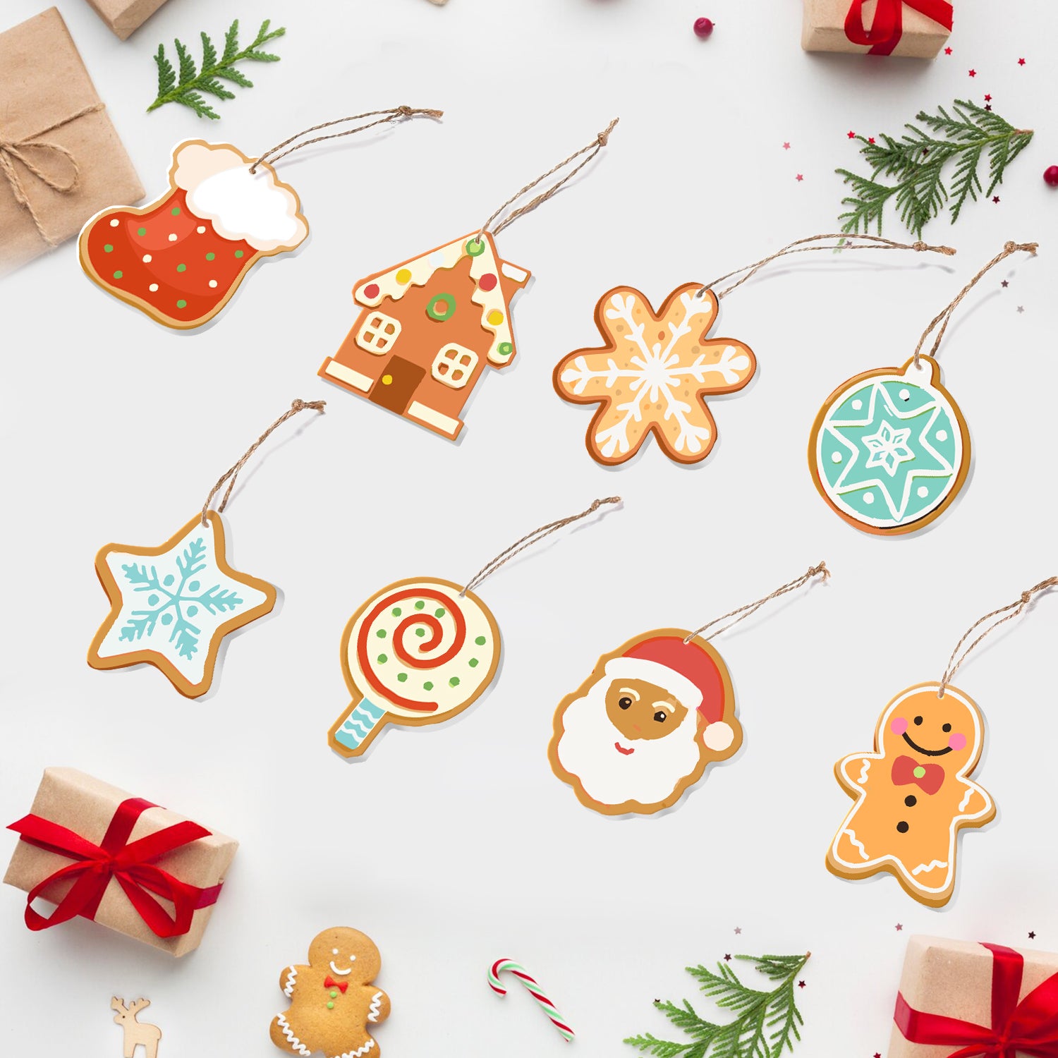 Coloridos adornos de galletas con temática navideña sobre un fondo blanco con cajas de regalo y bastones de caramelo.