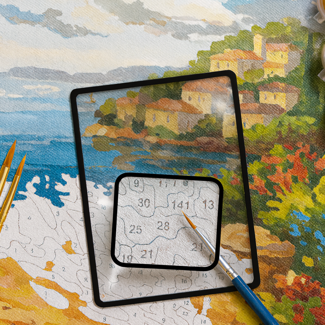 Jigsaw puzzle with a completed section showing a scenic village, surrounded by tools and another puzzle piece.