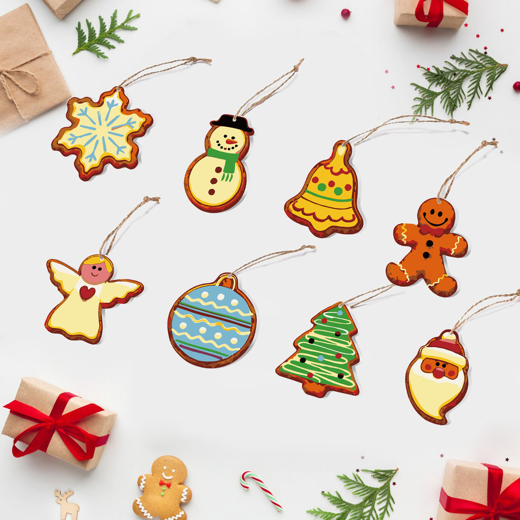 Colorful Christmas-themed cookie cutout ornaments on a white background with gift boxes and candy canes.