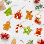Collection of Christmas-themed gingerbread cookies on a white background with small gifts and decorations.