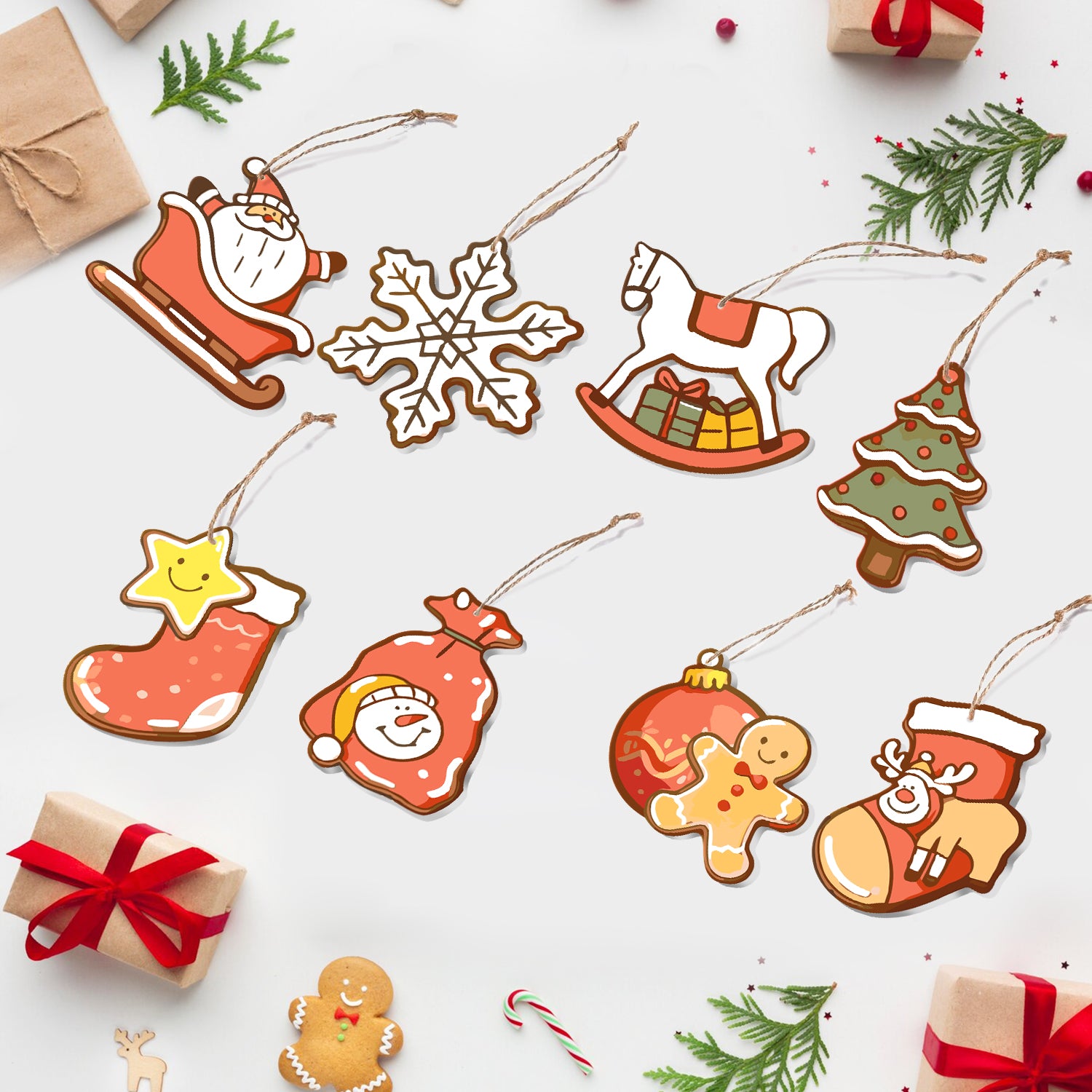 Collection d'ornements en céramique sur le thème de Noël sur fond blanc avec de petites boîtes cadeaux et des cannes de bonbon.