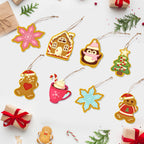 Colorful Christmas-themed paper ornaments on a white background with small gift boxes and candy canes.