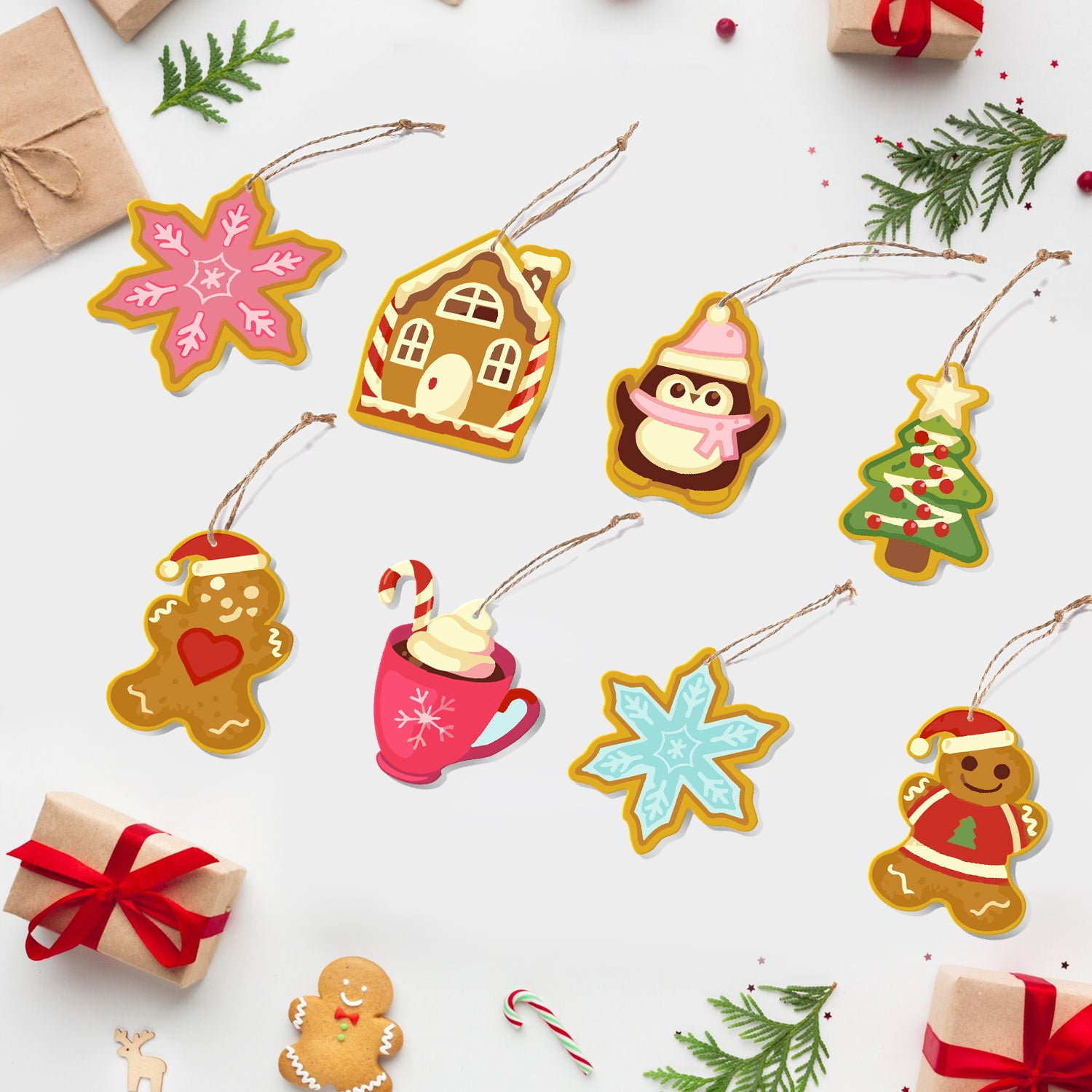 Coloridos adornos de papel con temática navideña sobre un fondo blanco con pequeñas cajas de regalo y bastones de caramelo.