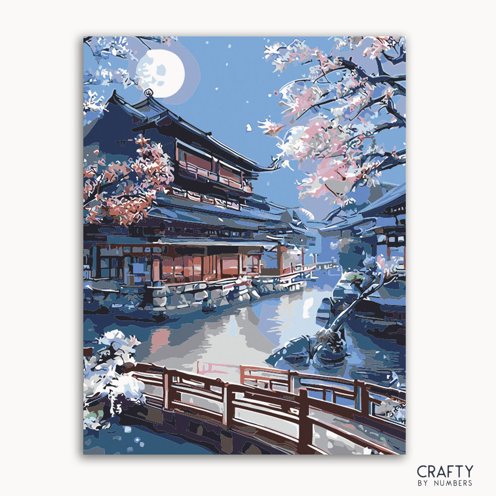 A paint by numbers kit depicting a Kyoto Shrine scene with a bridge, cherry blossoms, and a full moon.