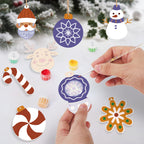 Decorative Christmas ornaments being painted with a hand holding a paintbrush.