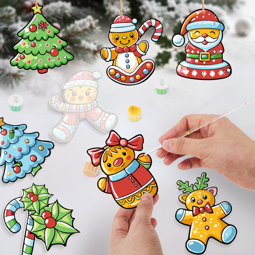 Colorful Christmas-themed paper cutouts with a hand holding one, set against a snowy background.