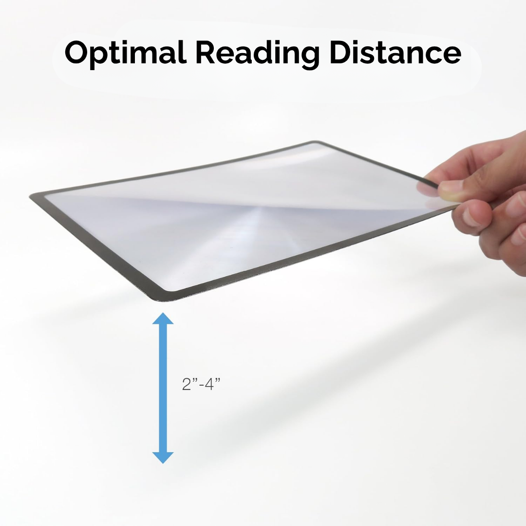 Hand holding a rectangular mirror with text indicating optimal reading distance on a white background