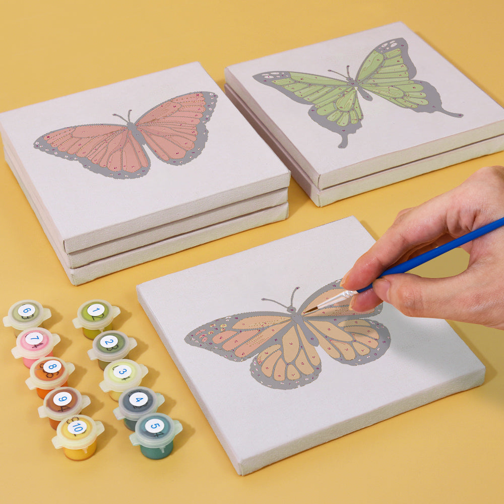 Colorful butterfly kaleidoscope painting in progress with numbered sections