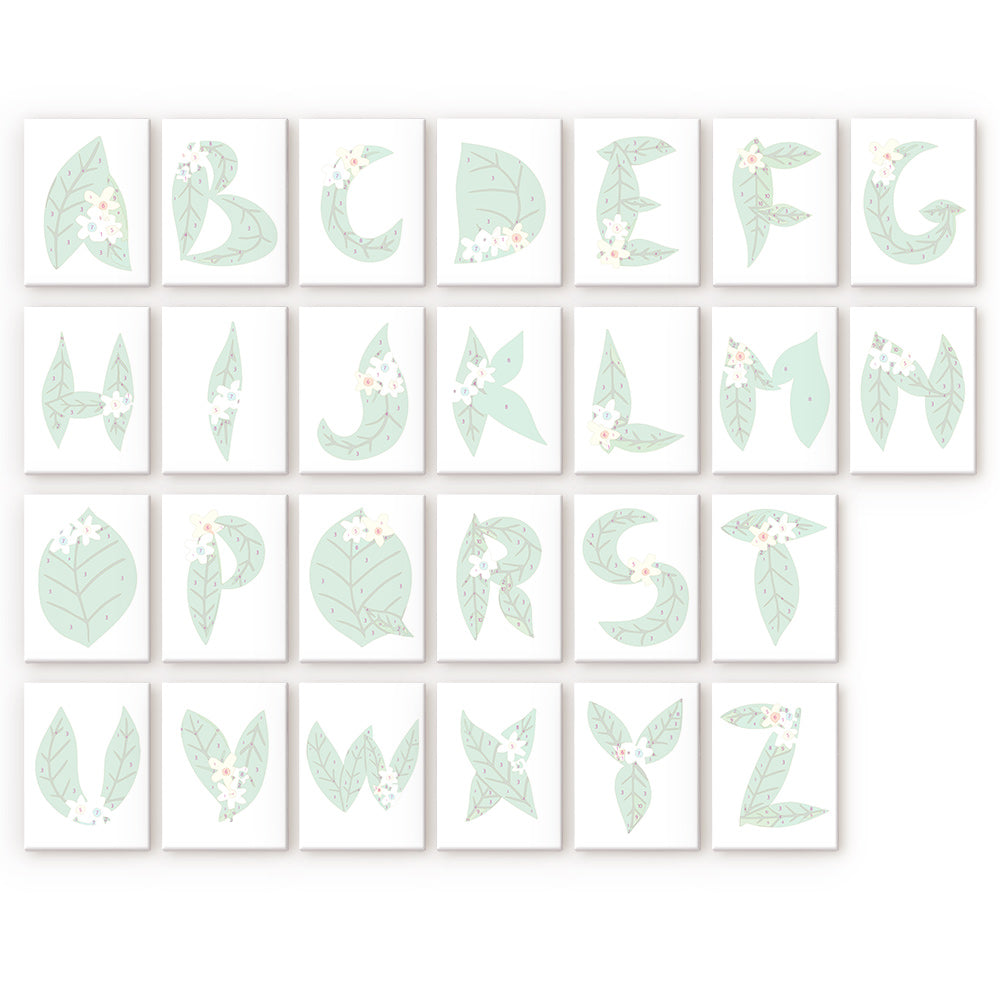 Alphabet cards with green leaf designs on a white background