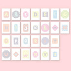 Alphabet letters in various pastel colors on a pink background