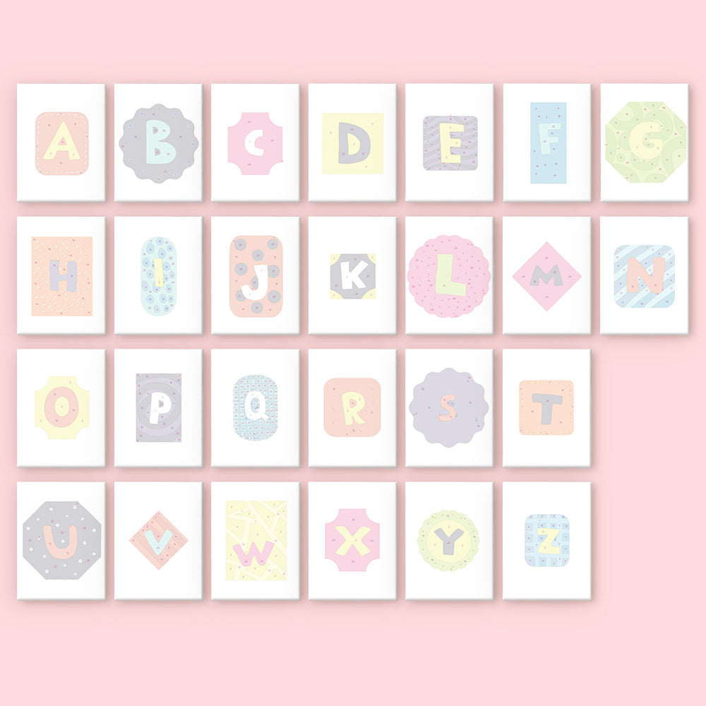 Alphabet letters in various pastel colors on a pink background