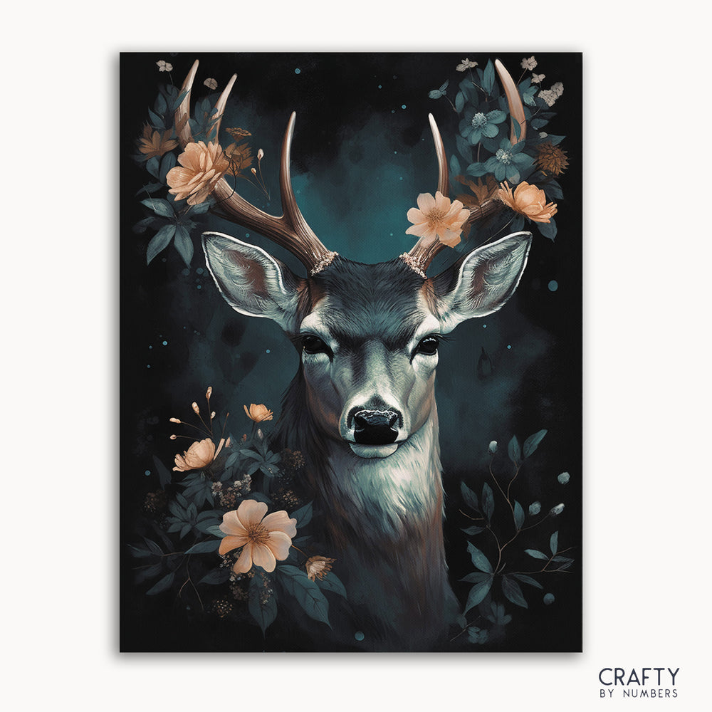 A paint by numbers kit depicting a floral deer in a forest setting with a Crafty by Numbers logo at the bottom.