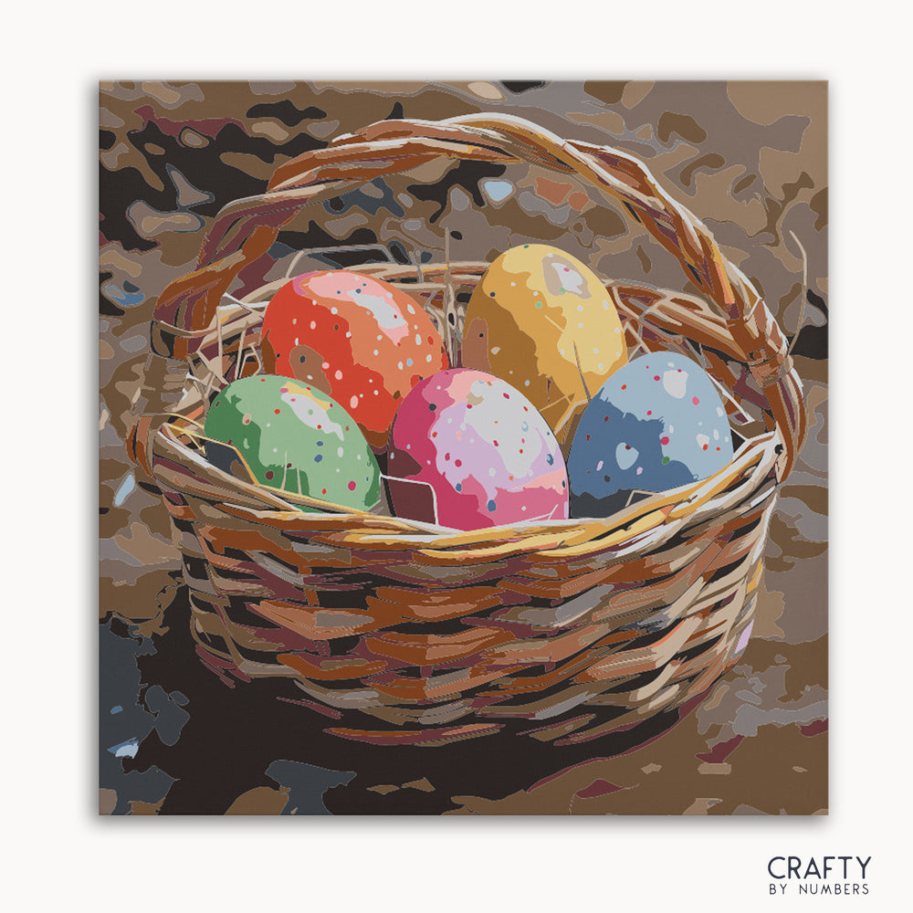 A paint-by-numbers kit canvas featuring a basket filled with colorful speckled eggs.