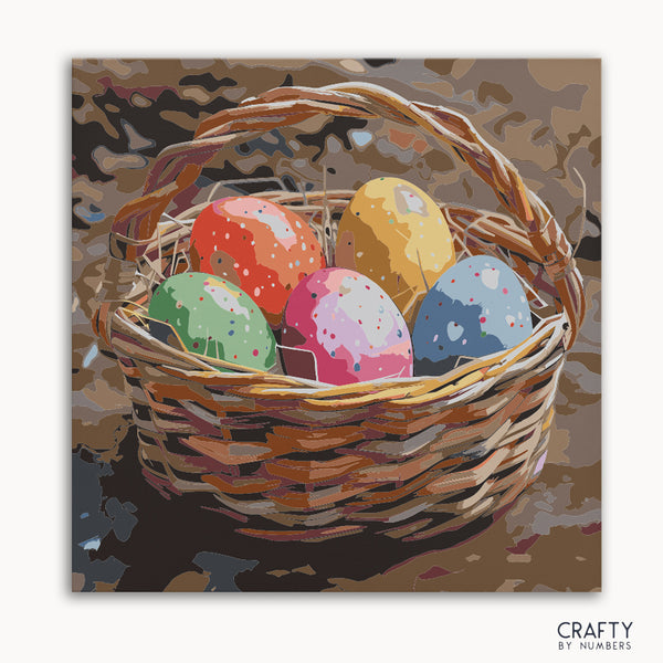 A paint-by-numbers kit canvas featuring a basket filled with colorful speckled eggs.