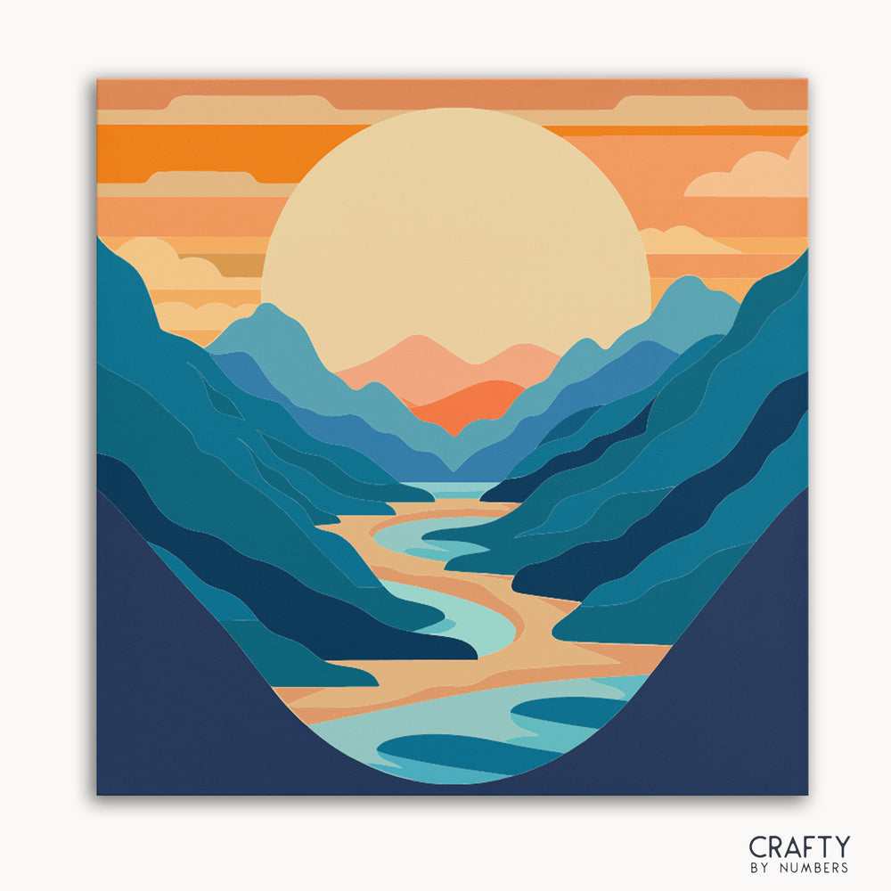 A paint-by-numbers kit depicting a mountain range with a setting sun and a winding river, with numbered areas for painting.