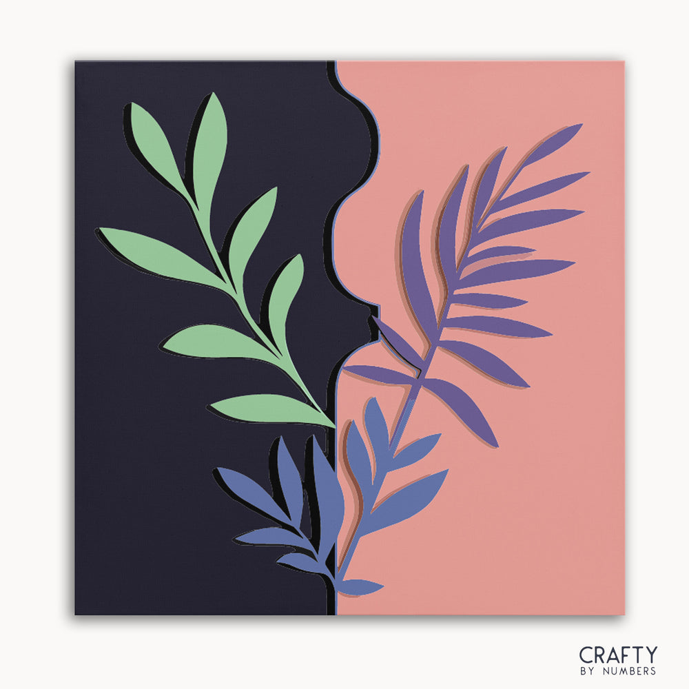 A paint by numbers kit with a design of stylized leaves on a dual-toned background, with a dark purple at the top and pink at the bottom.