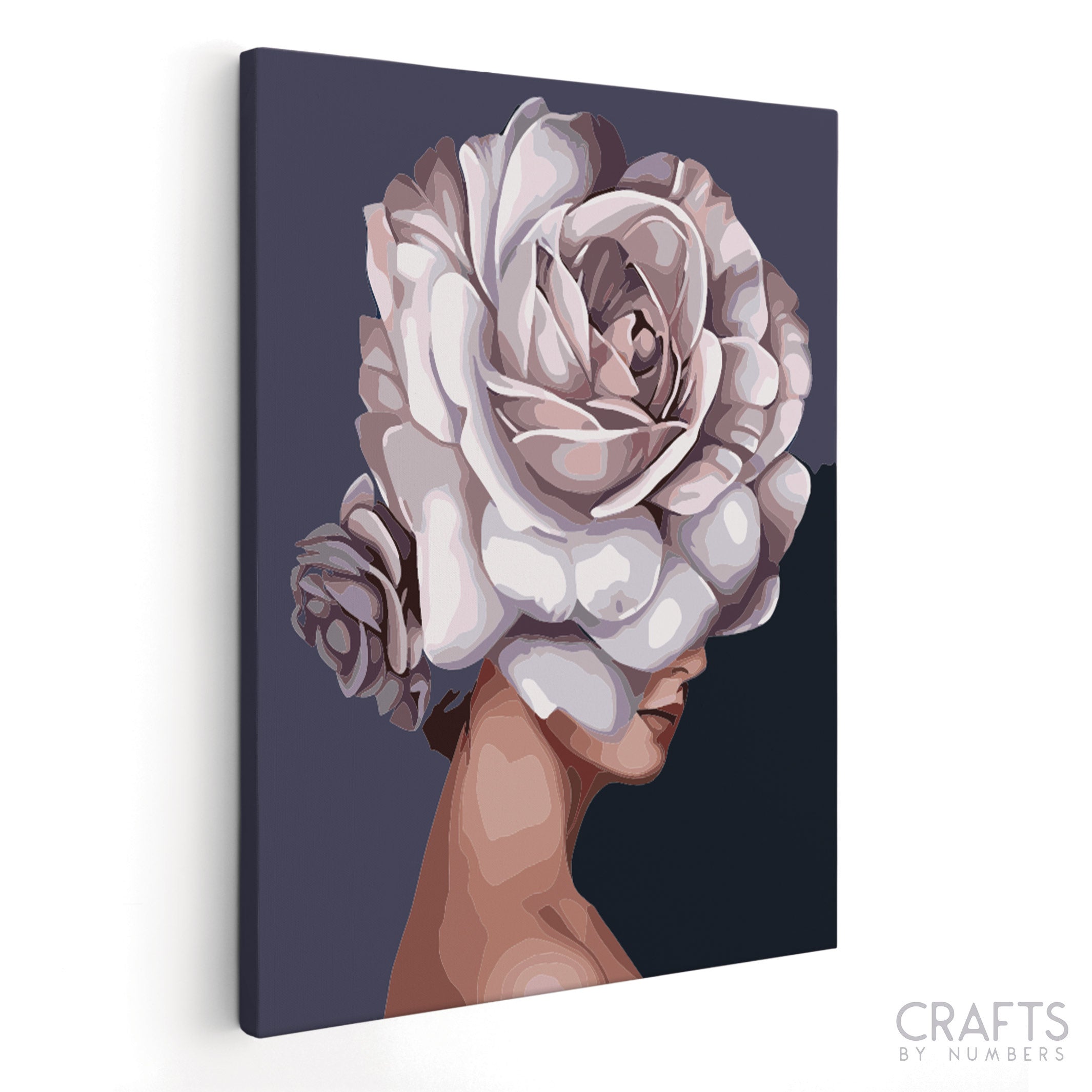 A paint-by-numbers kit depicting a woman's profile with a large floral headpiece in shades of white and gray.
