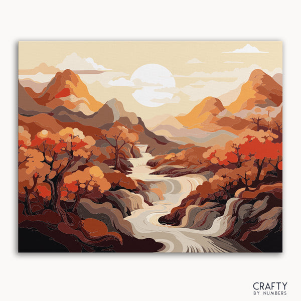 A paint by numbers kit depicting a vibrant autumnal landscape with a golden river, mountains, and trees.