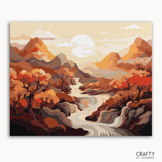Un kit de pintura por números que representa un vibrante paisaje otoñal con un río dorado, montañas y árboles.