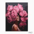 A paint by numbers kit depicting a portrait of a woman with a peony flower design.