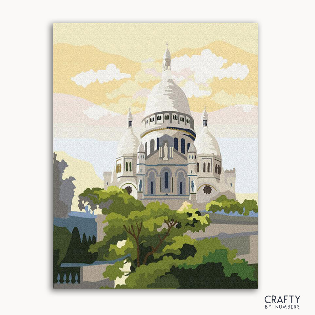 A painting of the Sacre Coeur Basilica with a vibrant blue sky, green trees, and a white building with a dome.