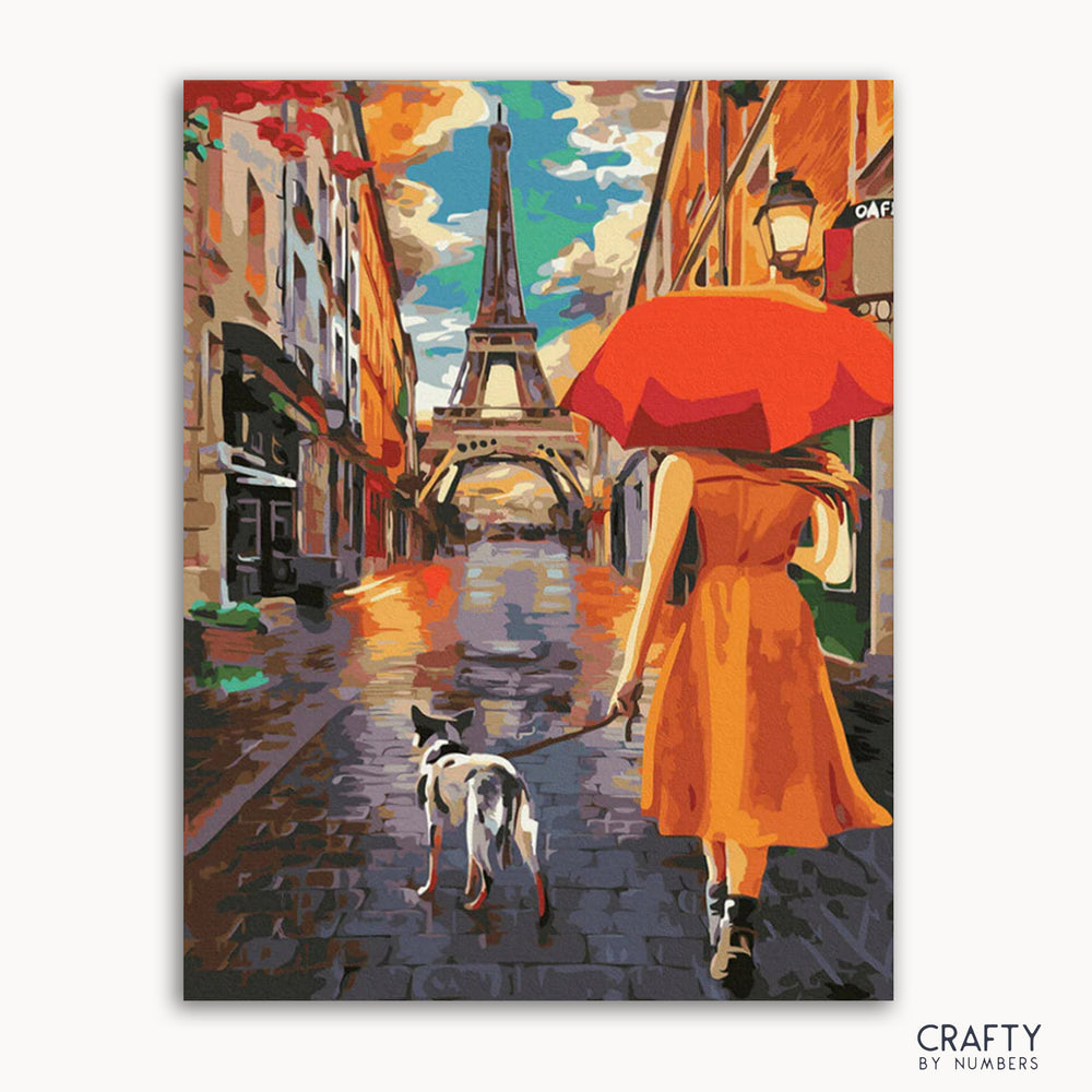 A painting depicting a woman in a yellow dress walking a dog on a street with the Eiffel Tower in the background. The sky is blue with some clouds, and it appears to be a sunny day.