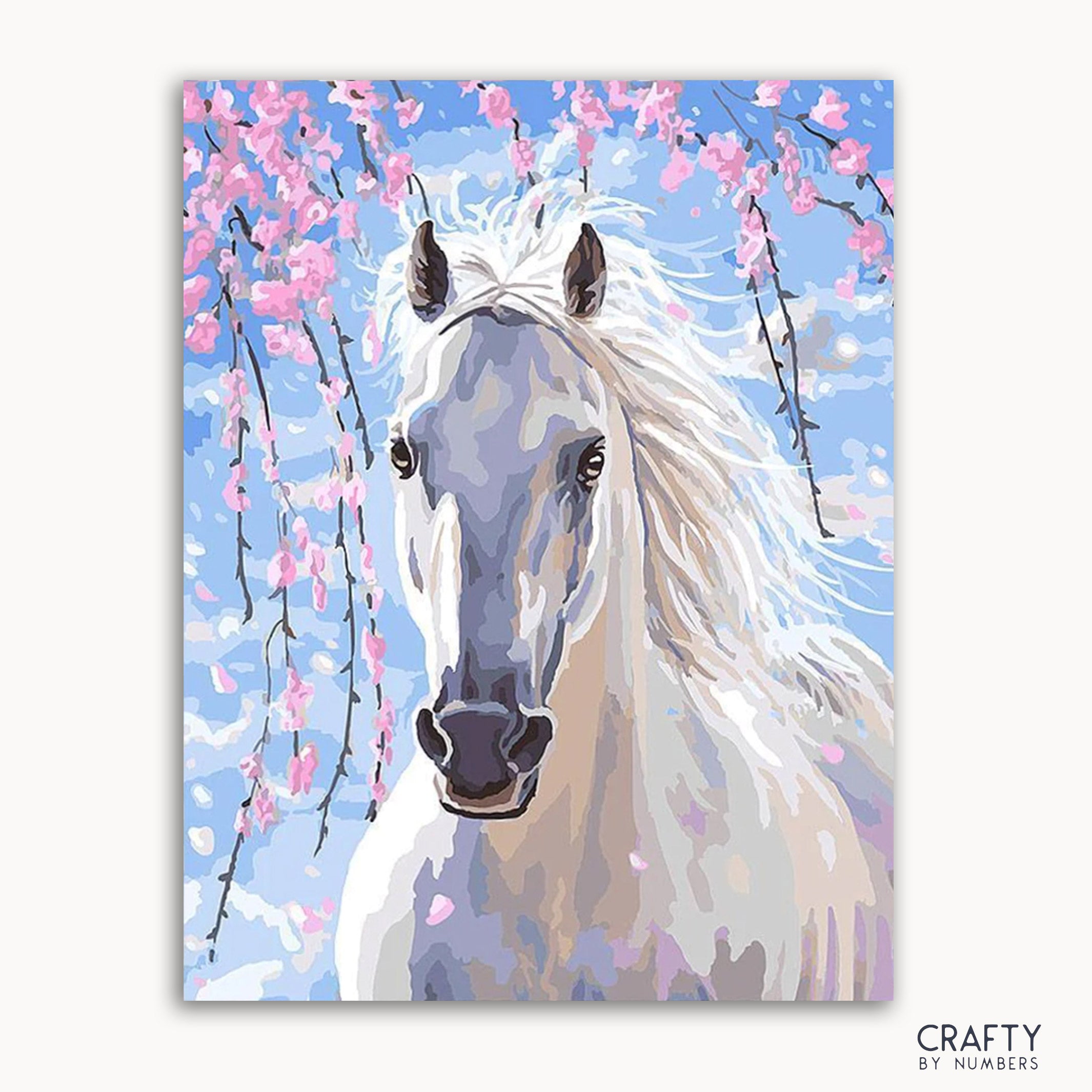 A paint-by-numbers kit depicting a white horse with pink cherry blossoms in the background.