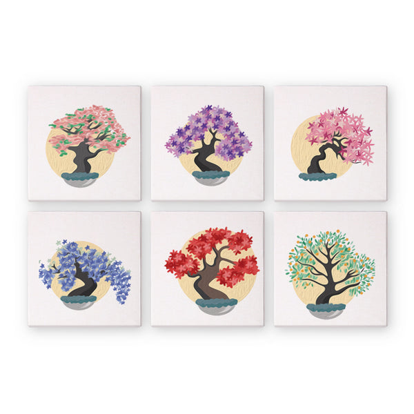 A set of six canvas paint-by-numbers kits with bonsai tree designs in various colors.