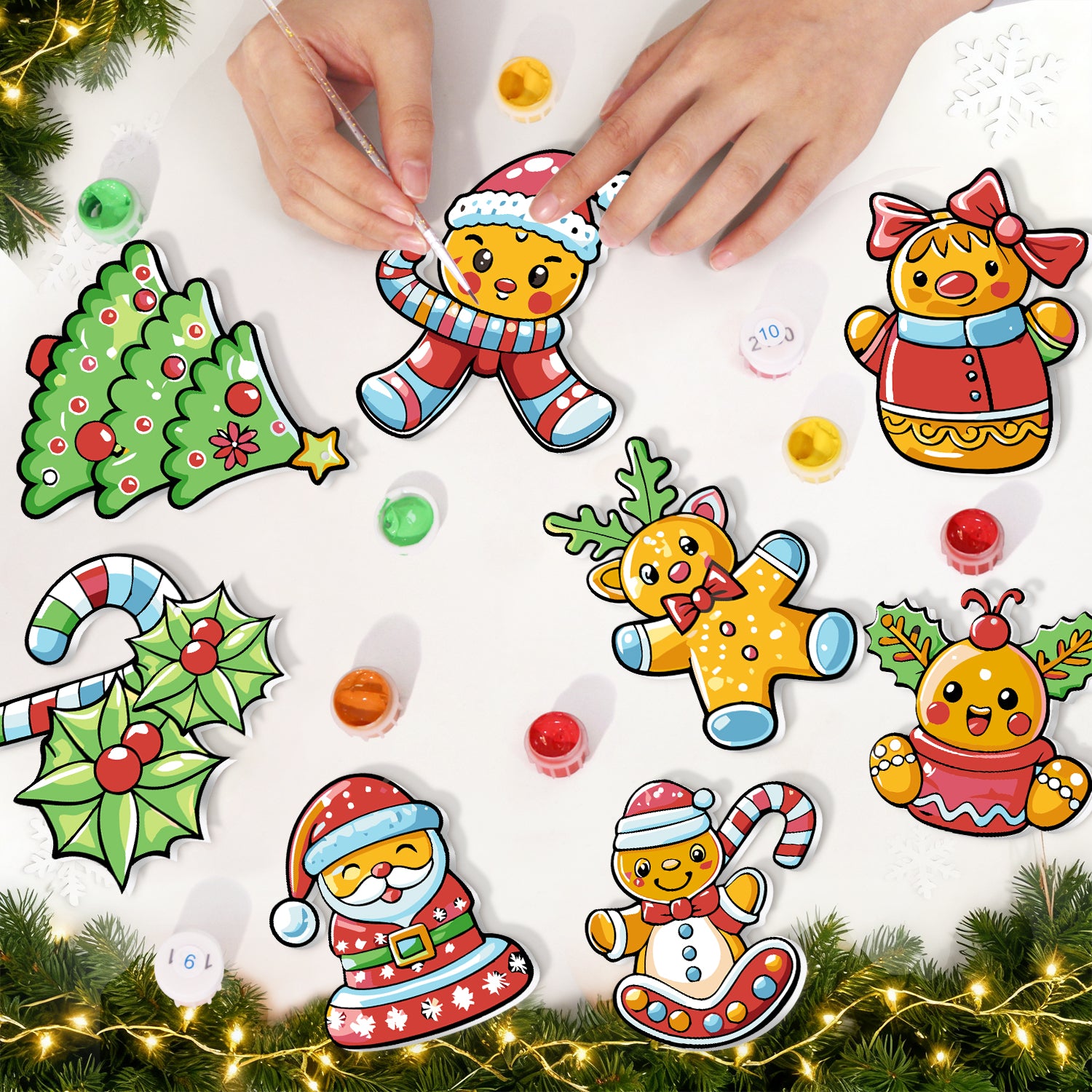 Colorful Christmas-themed stickers on a white surface with hands interacting with them.
