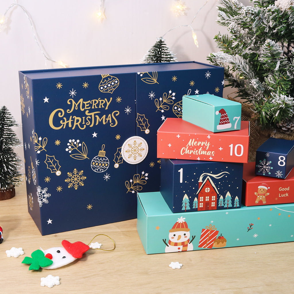 Advent calendar with numbered boxes on a wooden surface, Christmas tree in the background