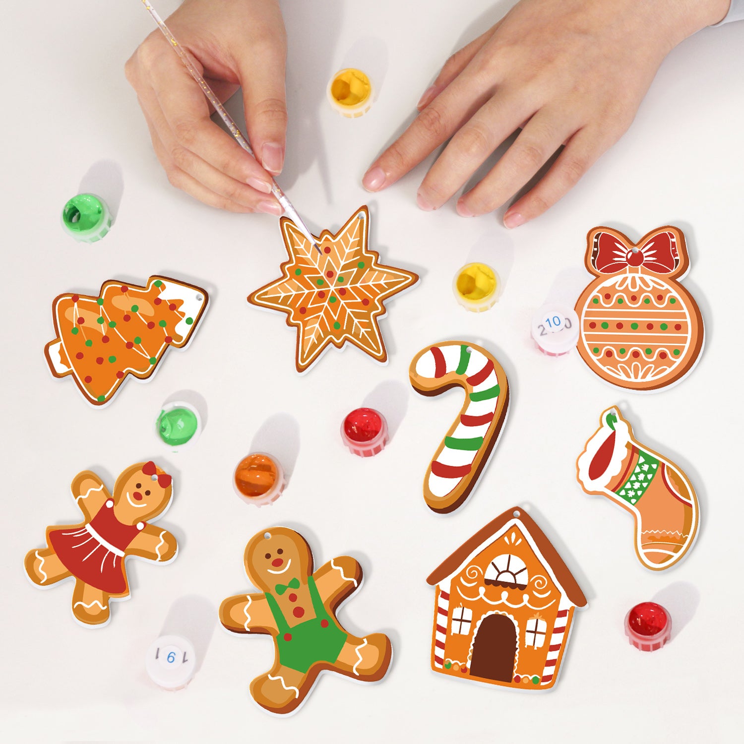 Decorative gingerbread cookies with icing on a white surface