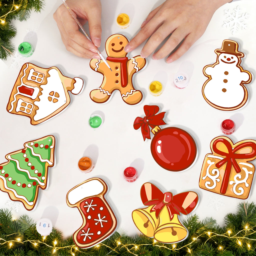 Decorative Christmas ornaments including a gingerbread man, snowman, tree, and bell on a white background.