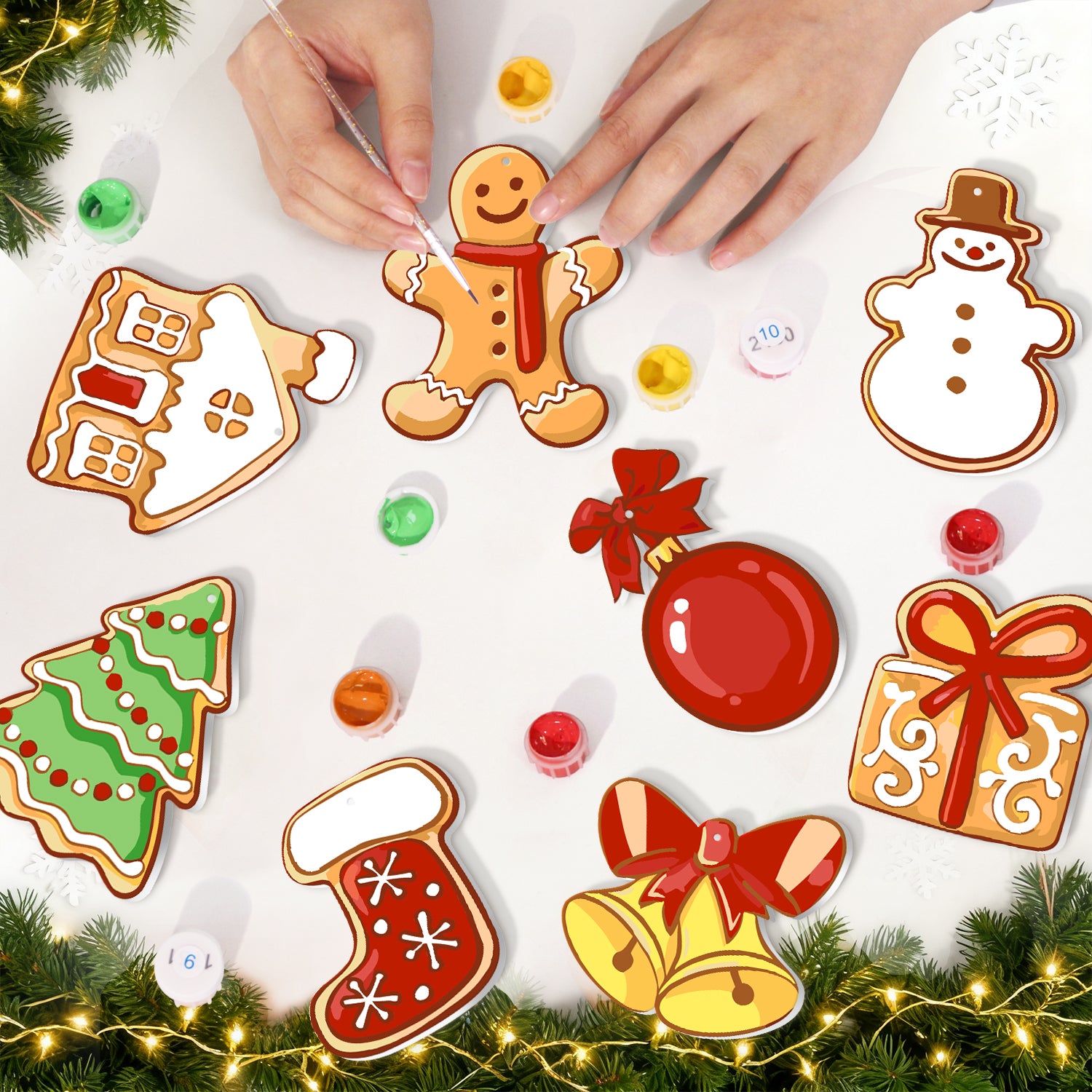 Decorative Christmas ornaments including a gingerbread man, snowman, tree, and bell on a white background.