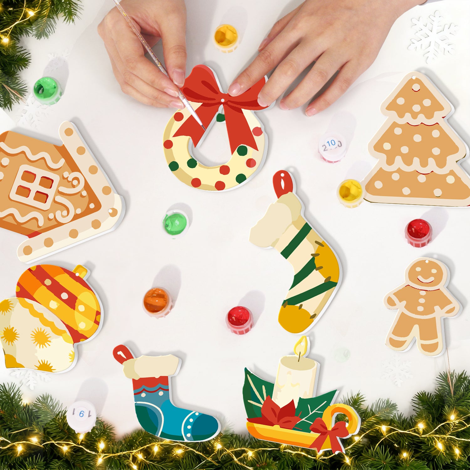 Christmas-themed wooden ornaments with hands arranging them on a white surface.