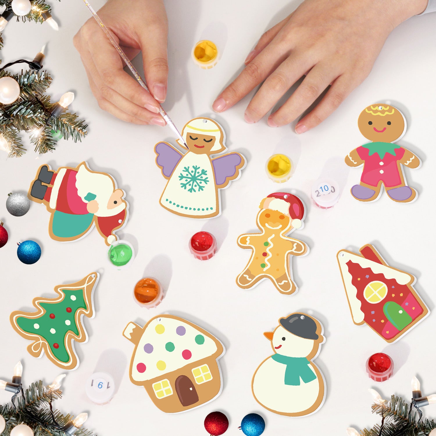 Children decorating Christmas-themed cookies with colorful icing on a white surface.