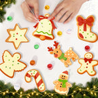 Christmas-themed cookie cutters on a white surface with decorative lights and greenery.