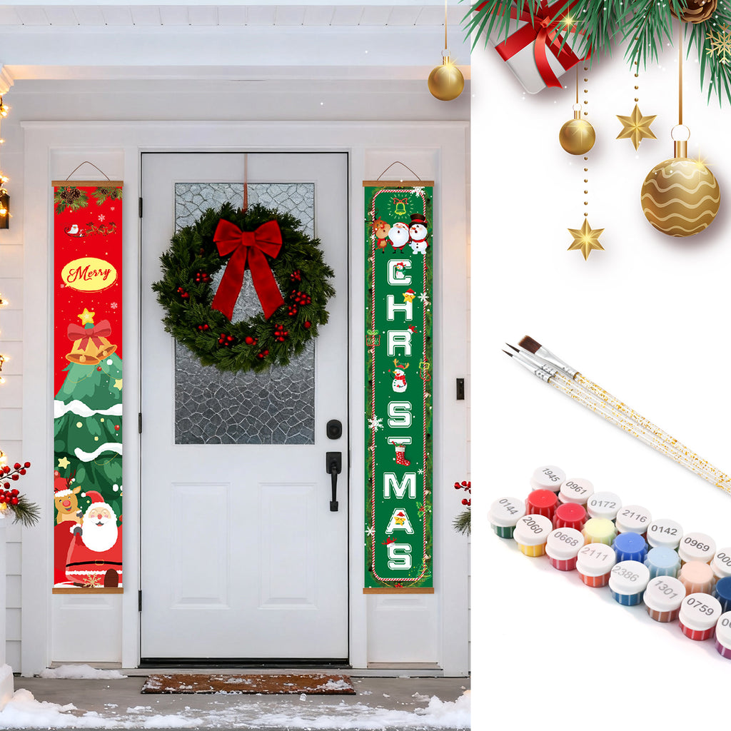 Adornos navideños que incluyen una corona, pancartas y materiales de pintura en una puerta blanca.