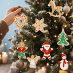 Hand hanging a heart-shaped cookie ornament on a decorated Christmas tree with other ornaments.