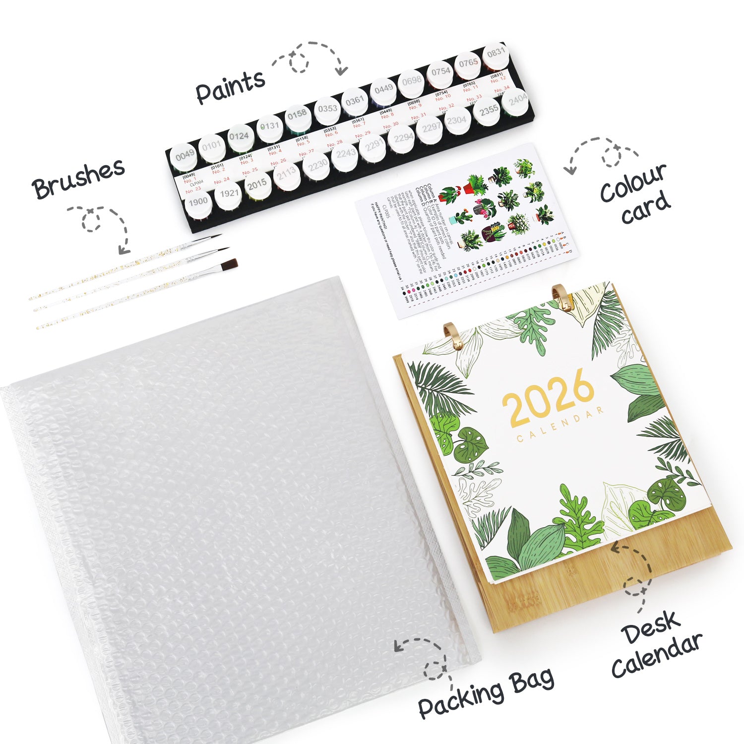 Calendario de escritorio 2026 con juego de pintura, pinceles y tarjeta de color sobre fondo blanco