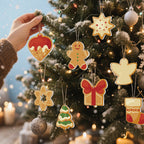 Hand placing a gingerbread man ornament on a decorated Christmas tree with other ornaments.