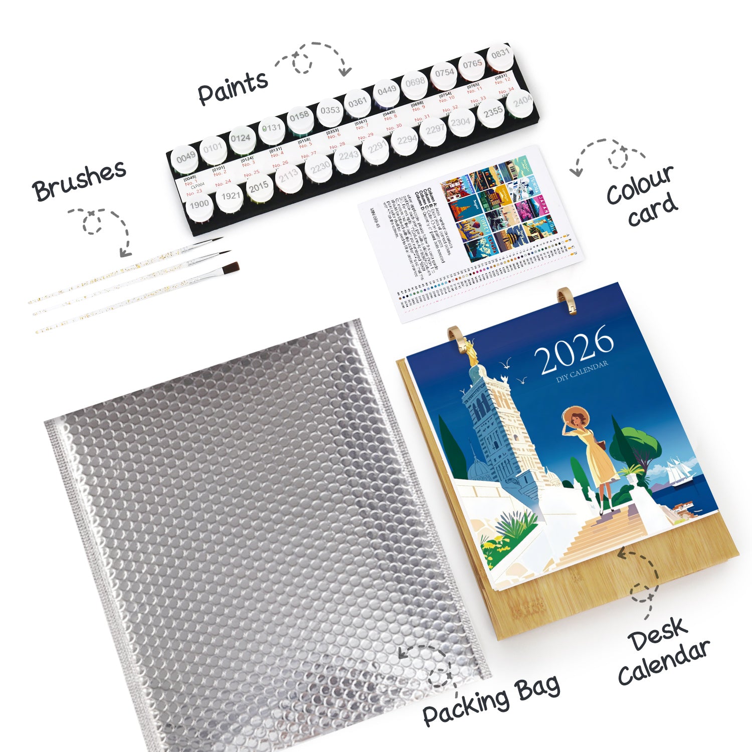 Desk calendar, bubble wrap, paintbrushes, and color card on a white background