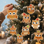 Decorative owl ornaments on a Christmas tree with a blurred background of lights and candles.