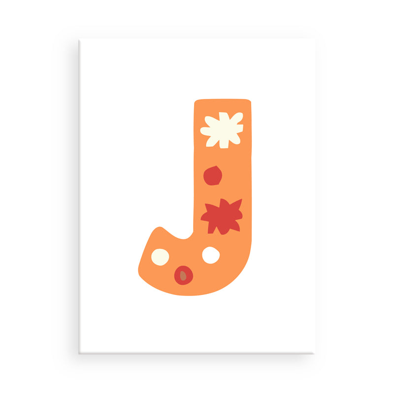 Decorative letter 'J' with floral patterns on a white background