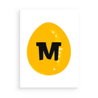 Yellow circle with a black letter 'M' on a white background