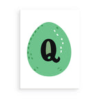 Green egg-shaped object with the letter 'q' on a white background