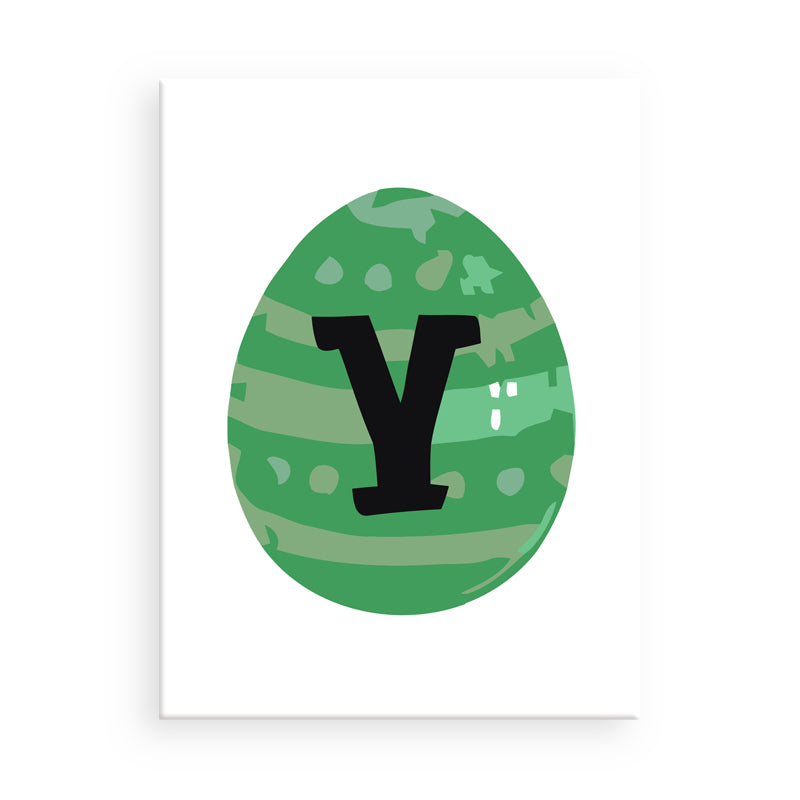 Green egg-shaped object with a black letter 'Y' on a white background