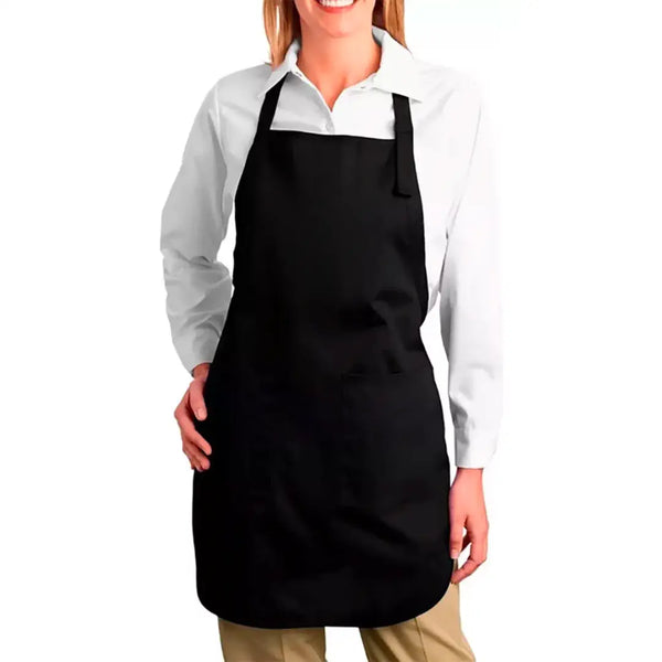 A person wearing a white shirt and a black professional apron with pockets.