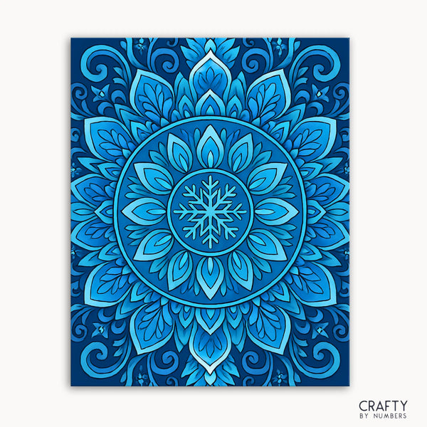 Arctic Spirit Mandala Paint by Numbers kit featuring a winter-themed mandala with soft blues and icy gradients centered around a radiant snowflake