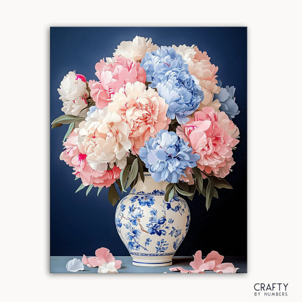A paint by numbers kit image showing a floral still life with peonies in a porcelain vase with blue details.